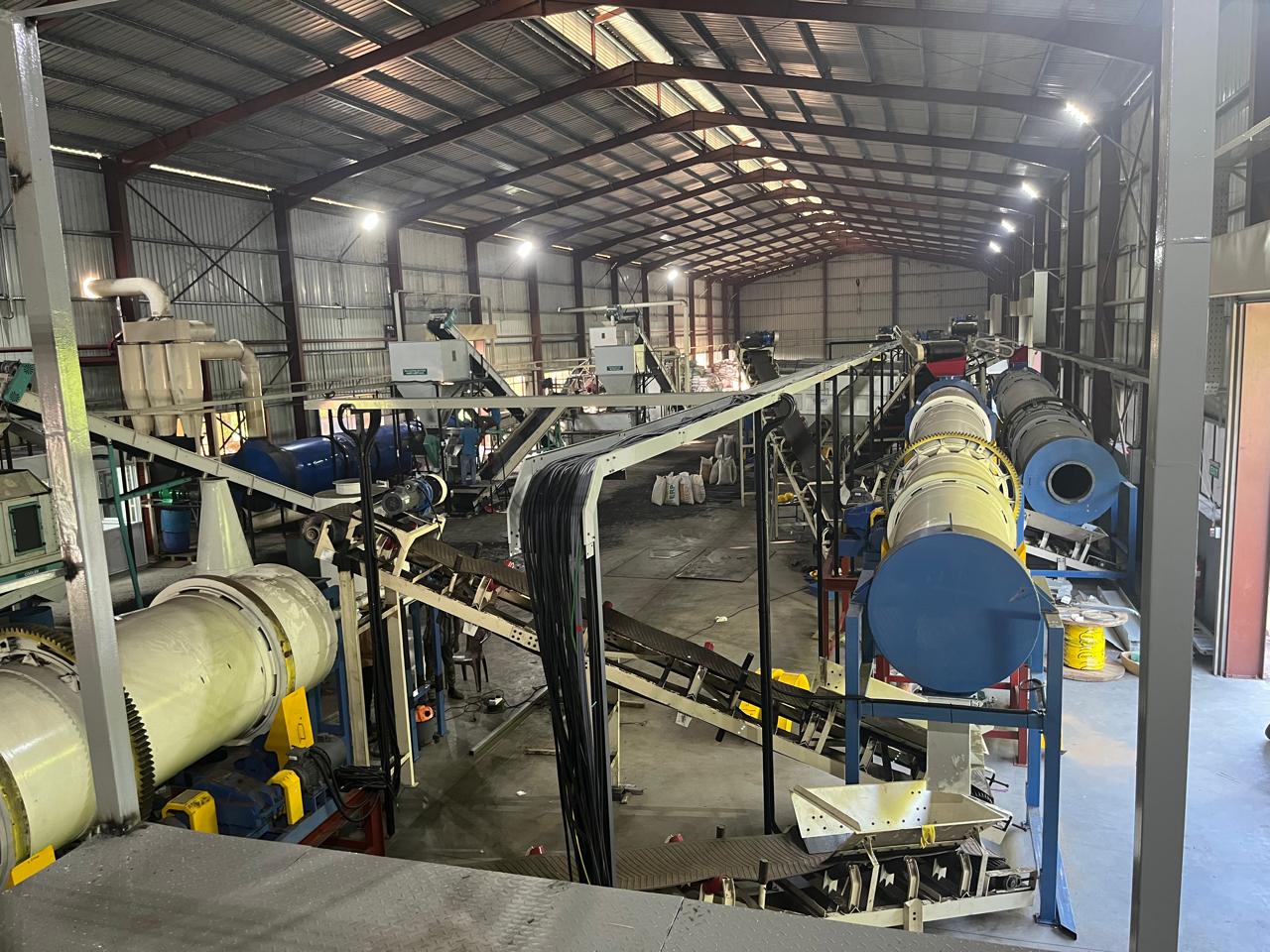Rotary drum granulator installed in a fertilizer plant.